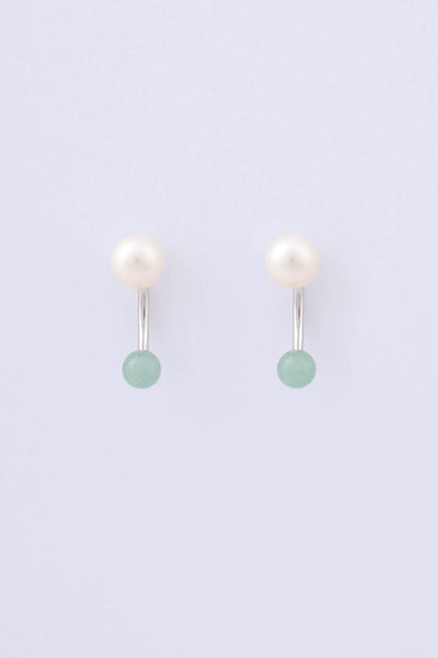 Pair of rhodium plated sterling silver earrings by Miro Miro, featuring a freshwater pearl and a spherical natural chrysoprase stone hanging from a curved ear jacket.