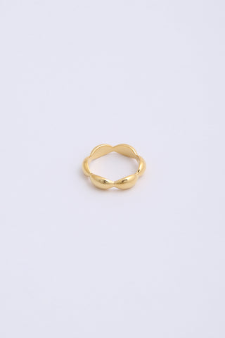 Bulbous, chunky gold ring with six even segments.