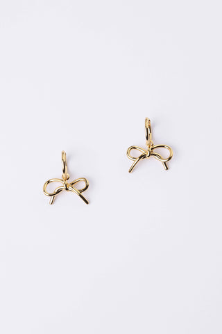 A pair of gold bow-shaped stud earrings on a clean white background.