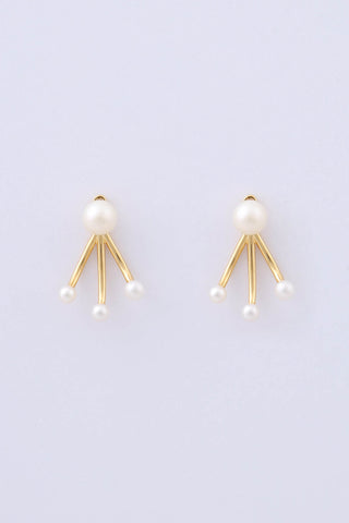 Pair of gold plated earrings by Miro Miro, featuring a natural freshwater pearl stud, and an ear jacket with three matching freshwater pearls on a pronged finish.