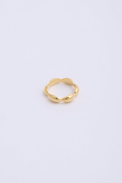 Bulbous, chunky gold ring with six even segments.