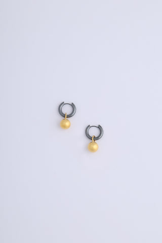 Oxidised silver hoop earrings with matte gold drop spheres