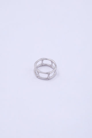Stacked multi-layer silver ring with bamboo shaped segments.